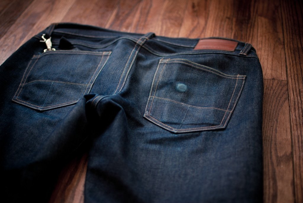 Faded raw denim Tellason jeans