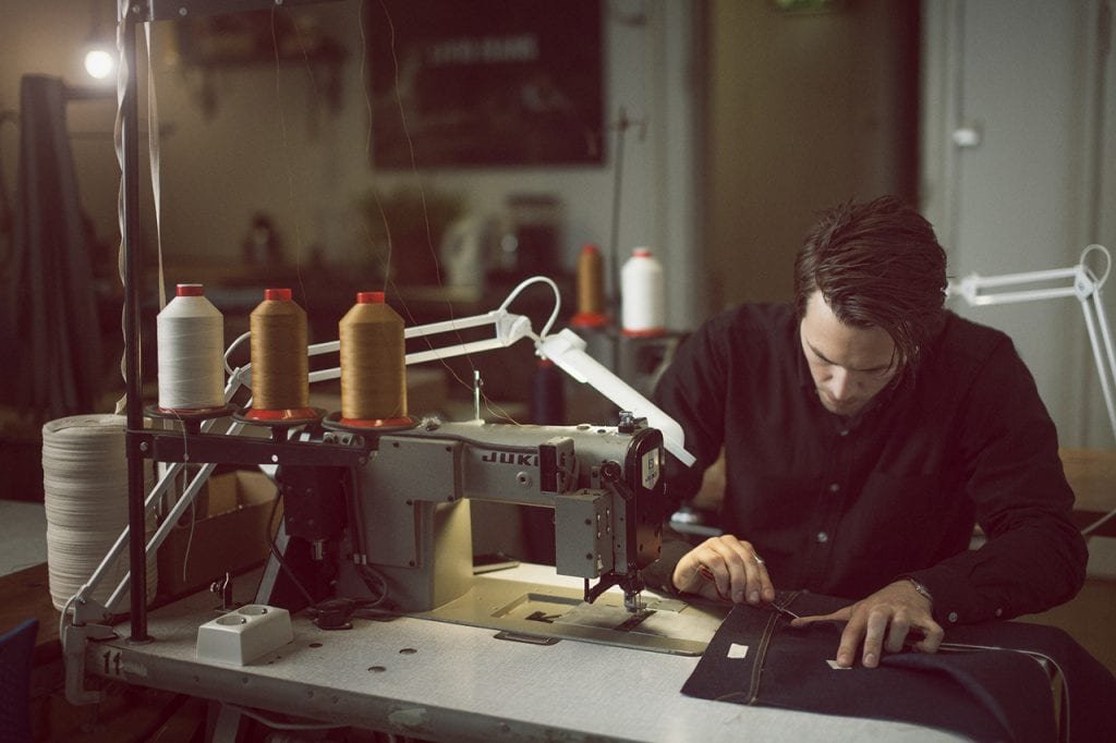 Jens Olav Dankertsen of Livid Jeans sewing jeans