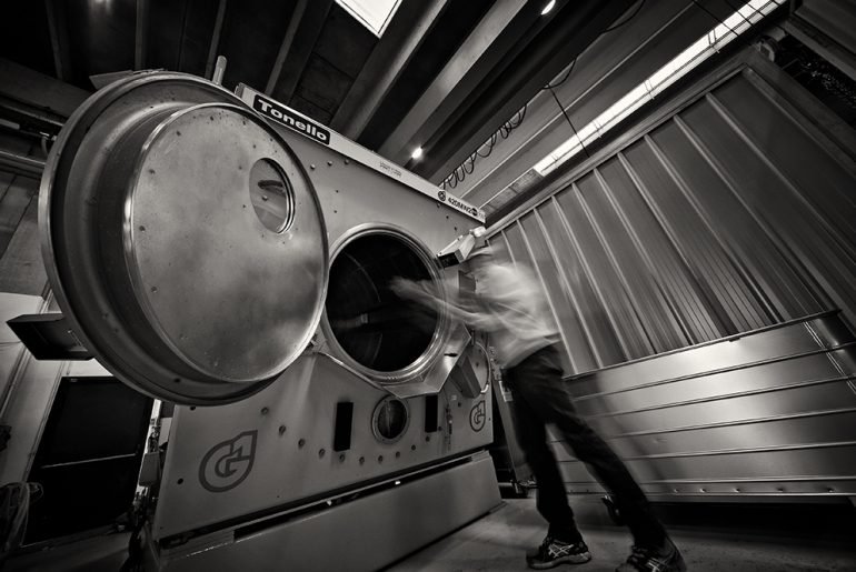 Tonello pre-washed jeans laundry machine being loaded