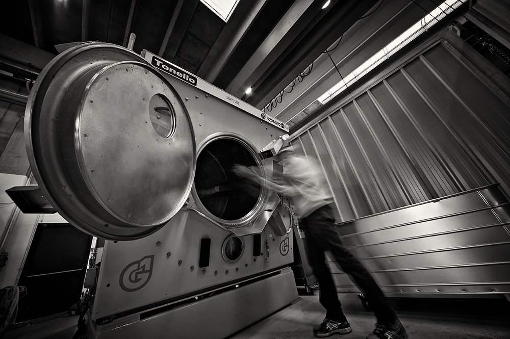 Tonello pre-washed jeans laundry machine being loaded
